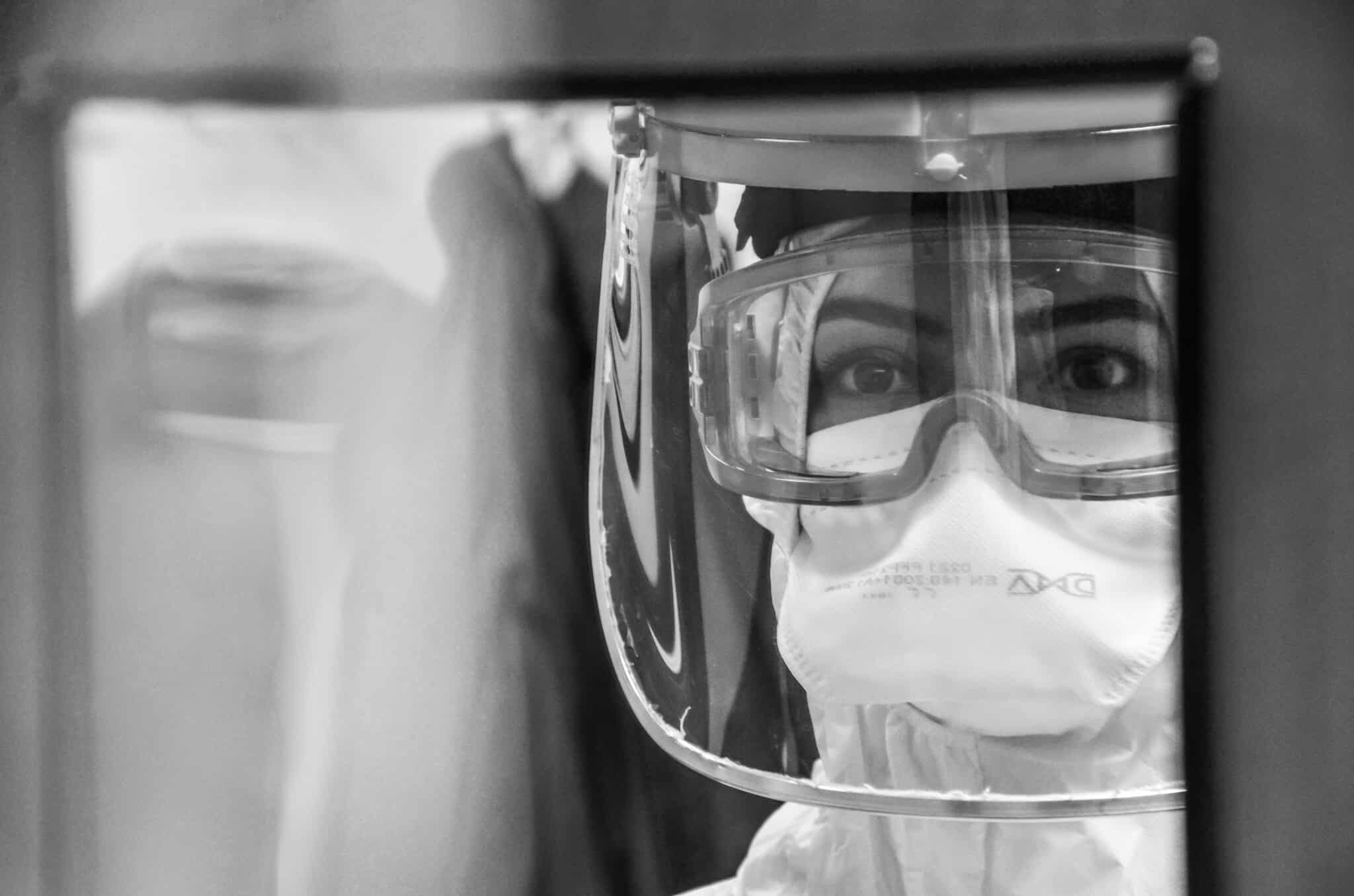 a heavily protected lab worker during the covid-19 outbreak