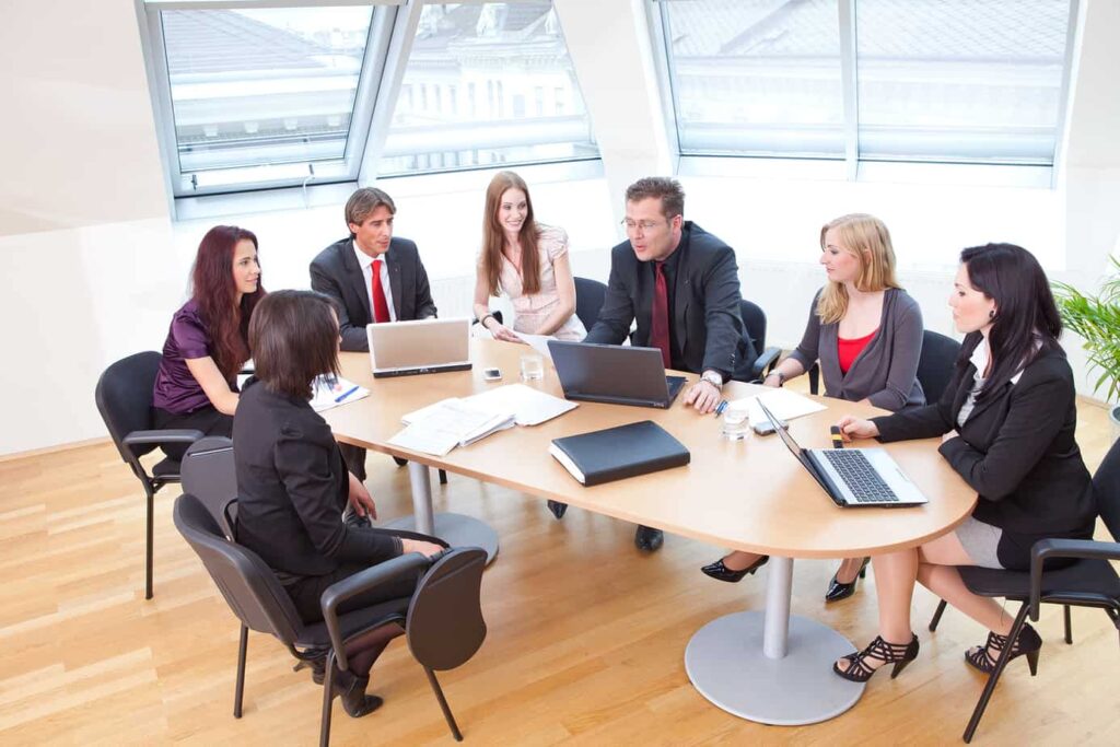 team in modern boardroom discussing strategy