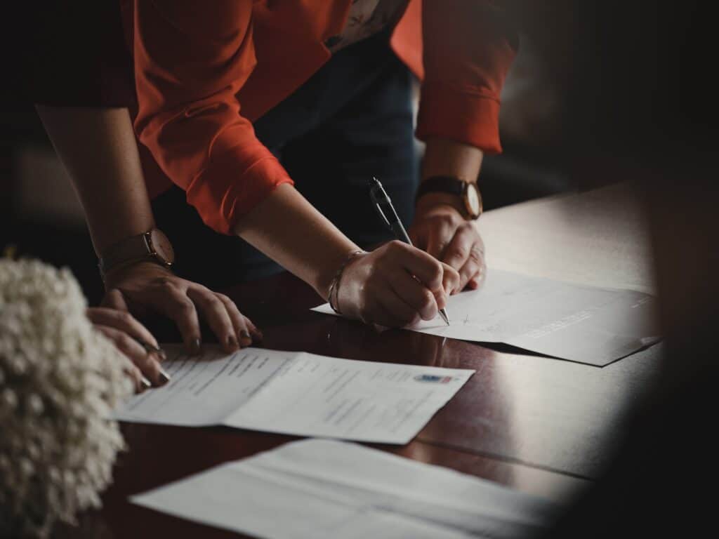 legal team signing on the dotted line