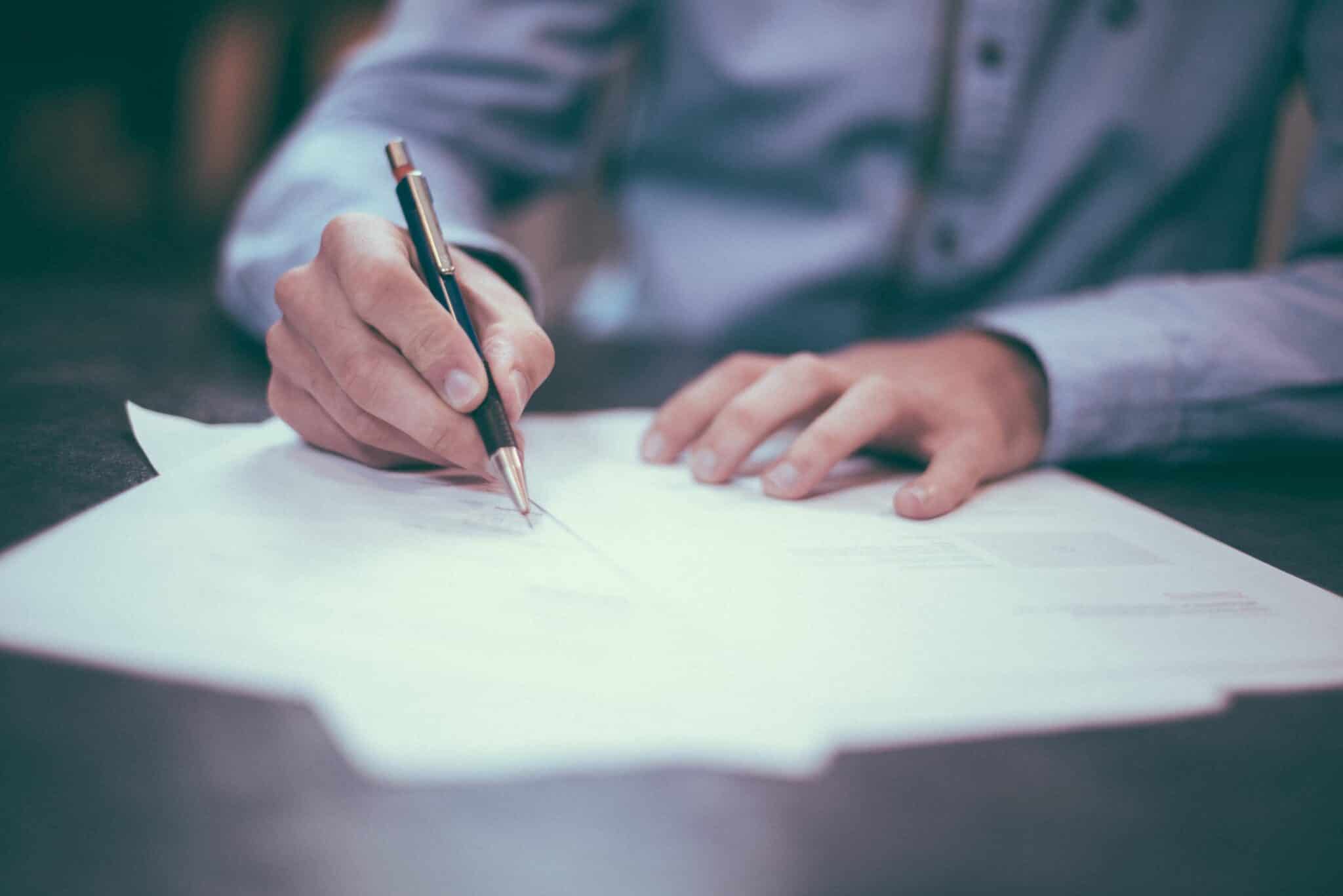 smart gentleman signing legal documents