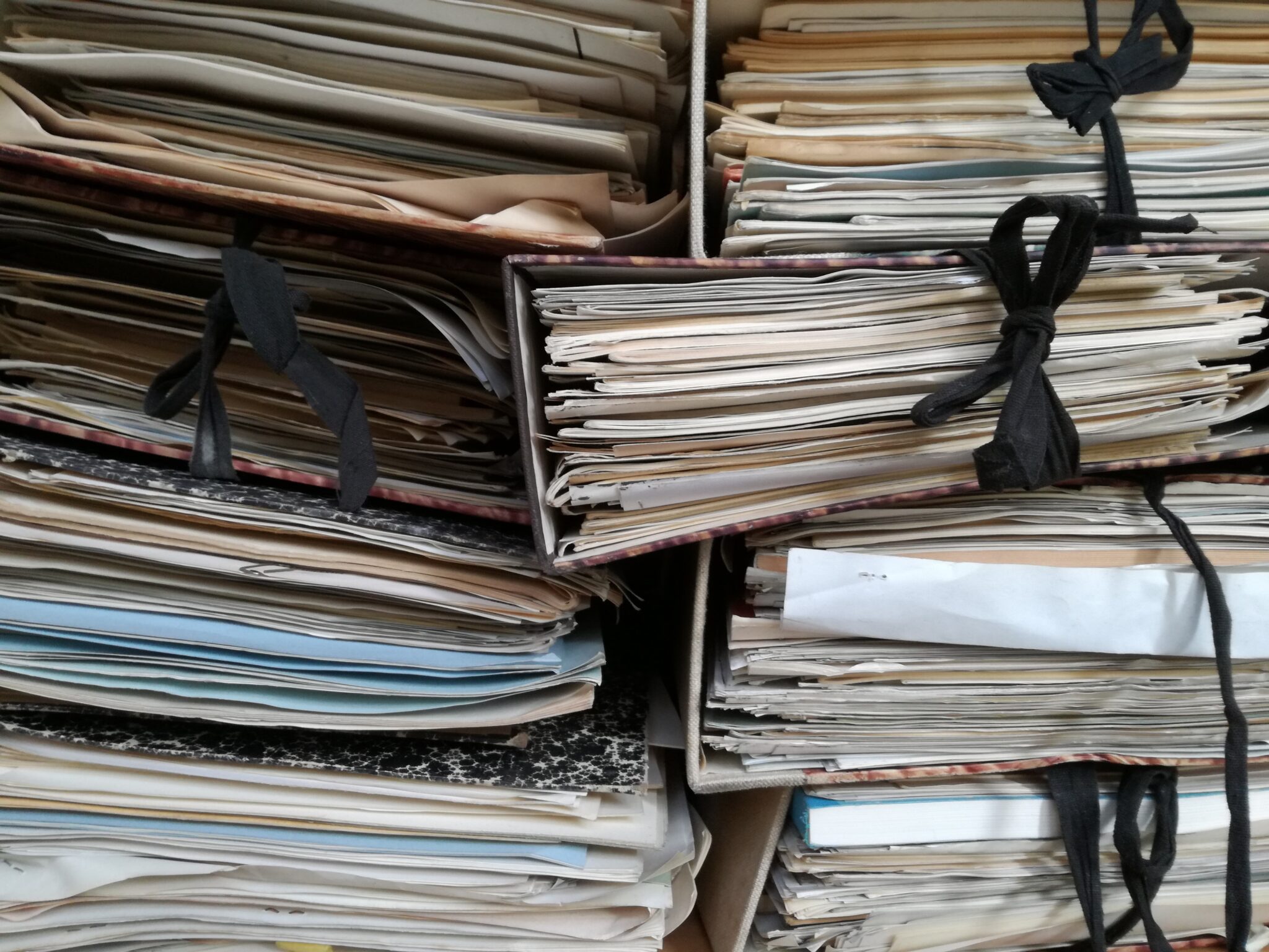 stacks of ribbon tied legal documents