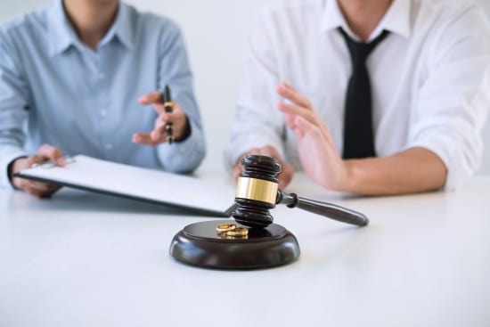 husband and wife during divorce process and signing of divorce contract, Wedding ring
